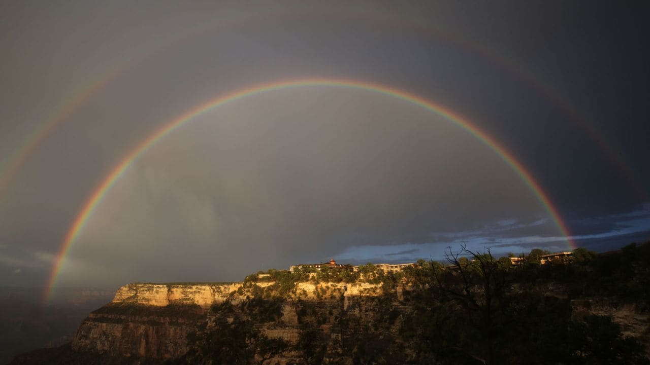 A double rainbow shines over El Tovar Hotel on the Grand Canyon’s South Rim the night before the hike.
