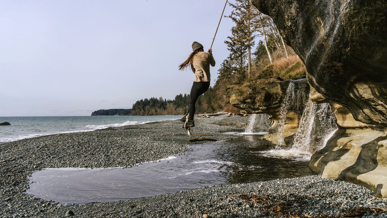 The author swings on a rope at Sandcut Beach.